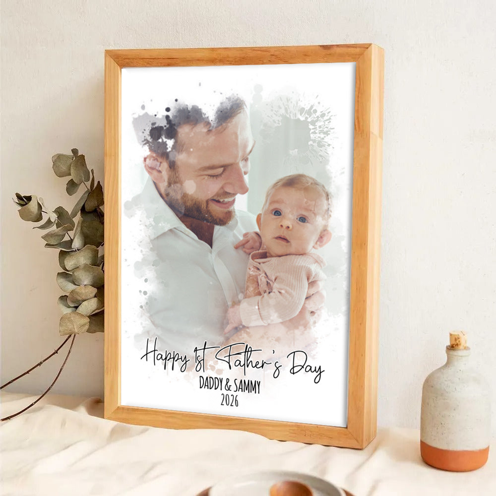 Custom Photo Watercolor First Father's Day poster, leaning against a wall on a wooden floor
