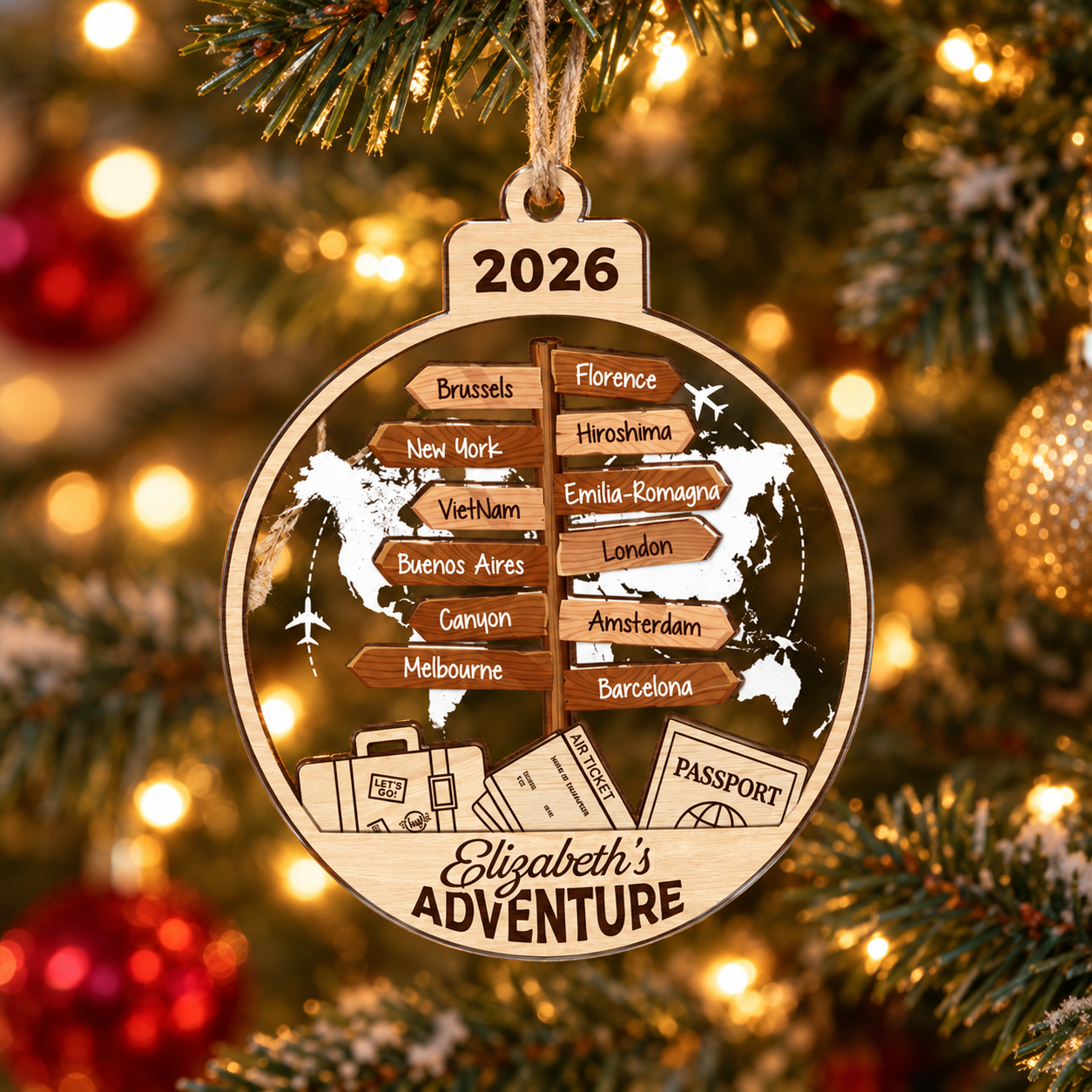 Personalized travel destination signpost ornament Elizabeth's Adventure 2026 on a Christmas tree