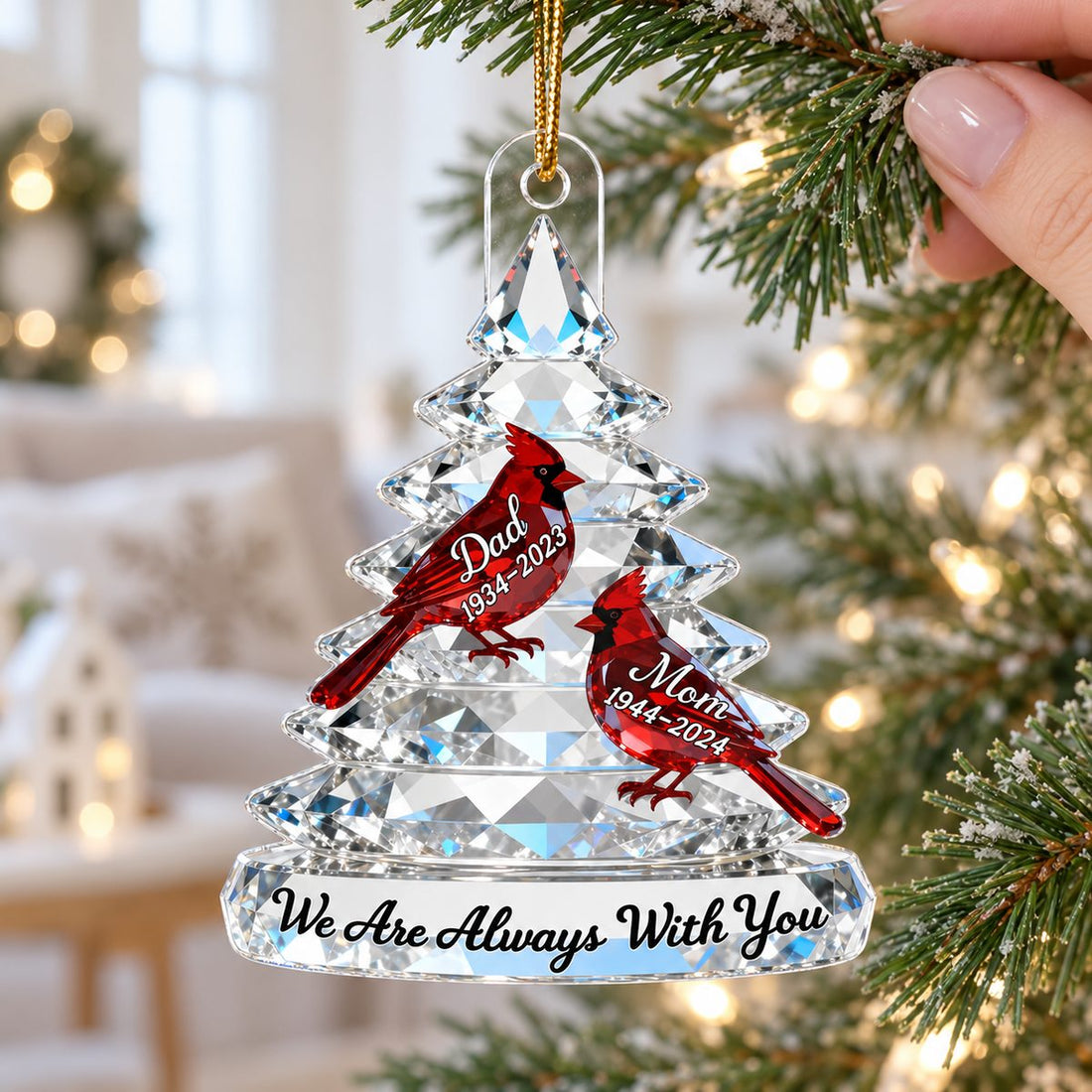 Close-up of Memorial Tree Cardinals Christmas personalized acrylic ornament on a bright Christmas tree.