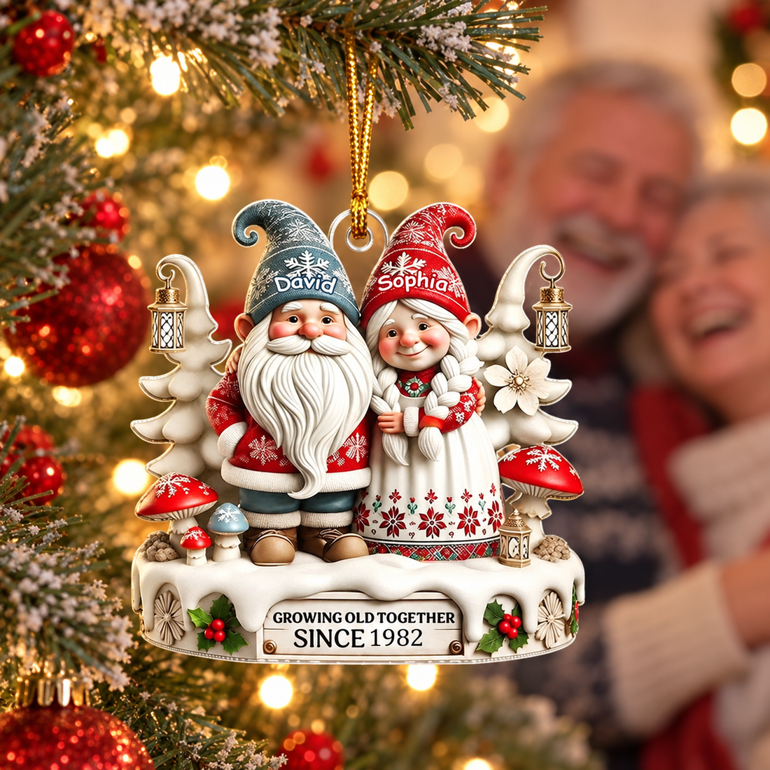 Gnome couple Growing Old Together ornament hanging on a Christmas tree with an older couple behind