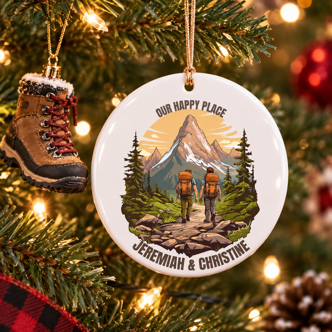 Personalized hiking couple ceramic ornament on a Christmas tree beside a mini hiking boot