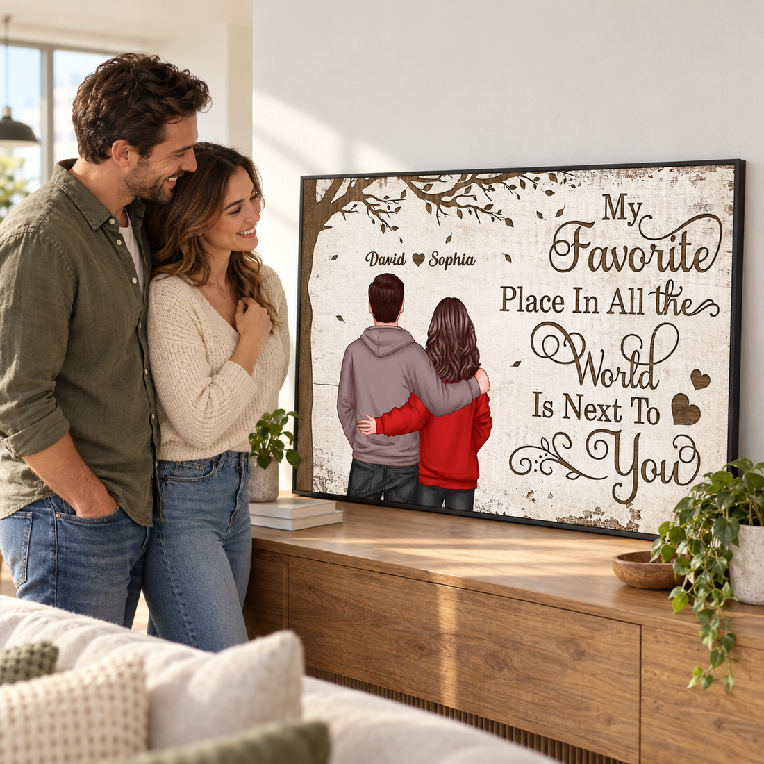 Happy couple smiling at their personalized My Favorite Place canvas print in a new apartment