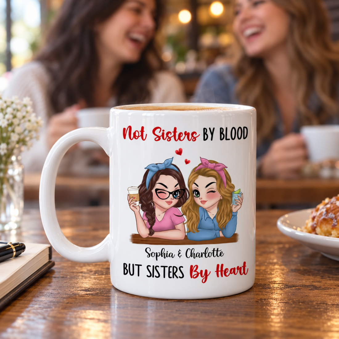 Personalized Not Sisters By Blood But Sisters By Heart mug on a cafe table with friends