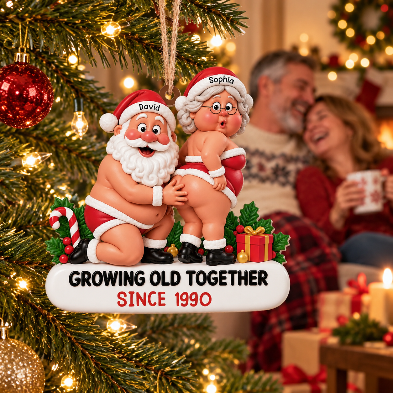 Personalized Santa couple Growing Old Together acrylic ornament on a Christmas tree with a laughing couple behind