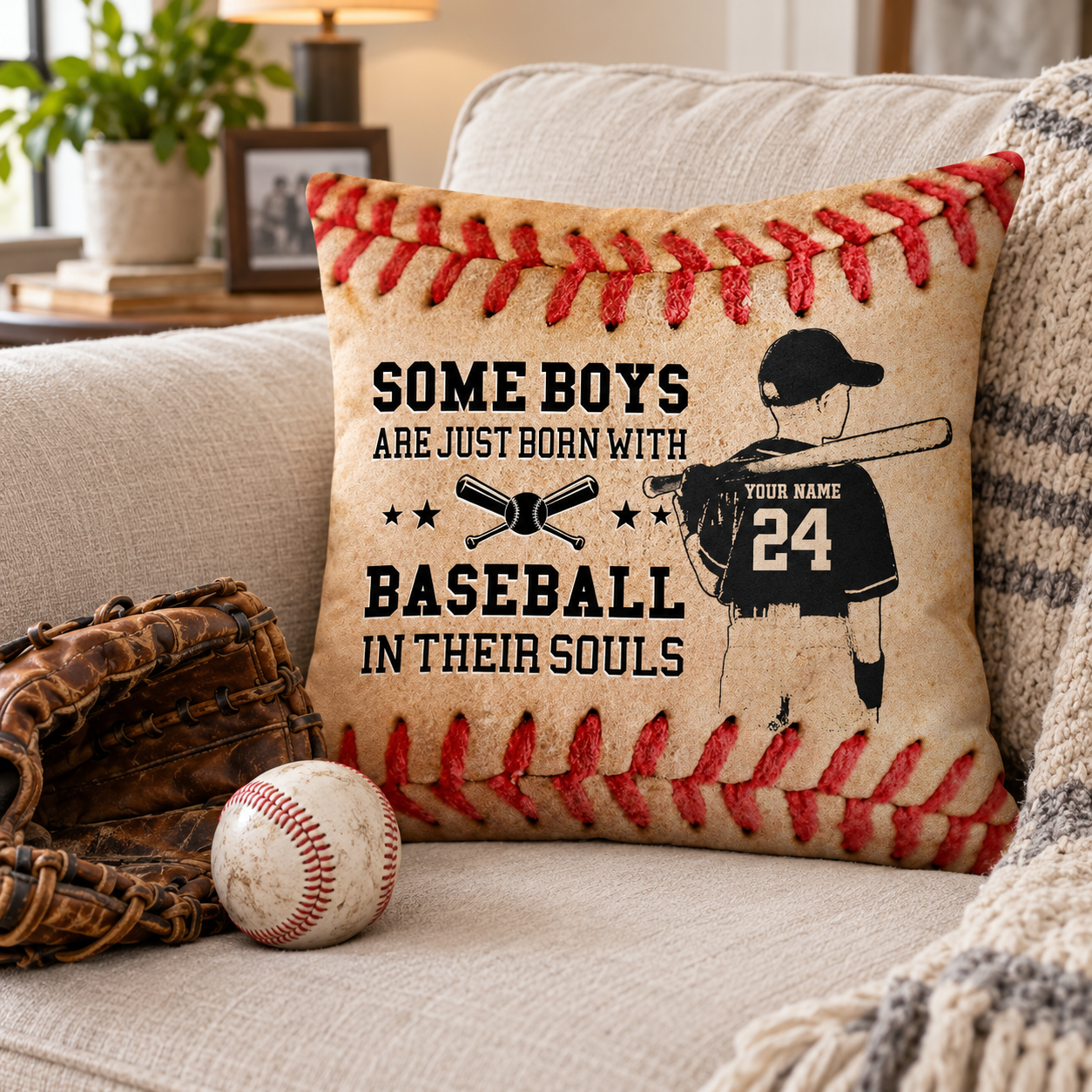 Personalized baseball grandson pillow on a sofa beside a baseball glove and ball