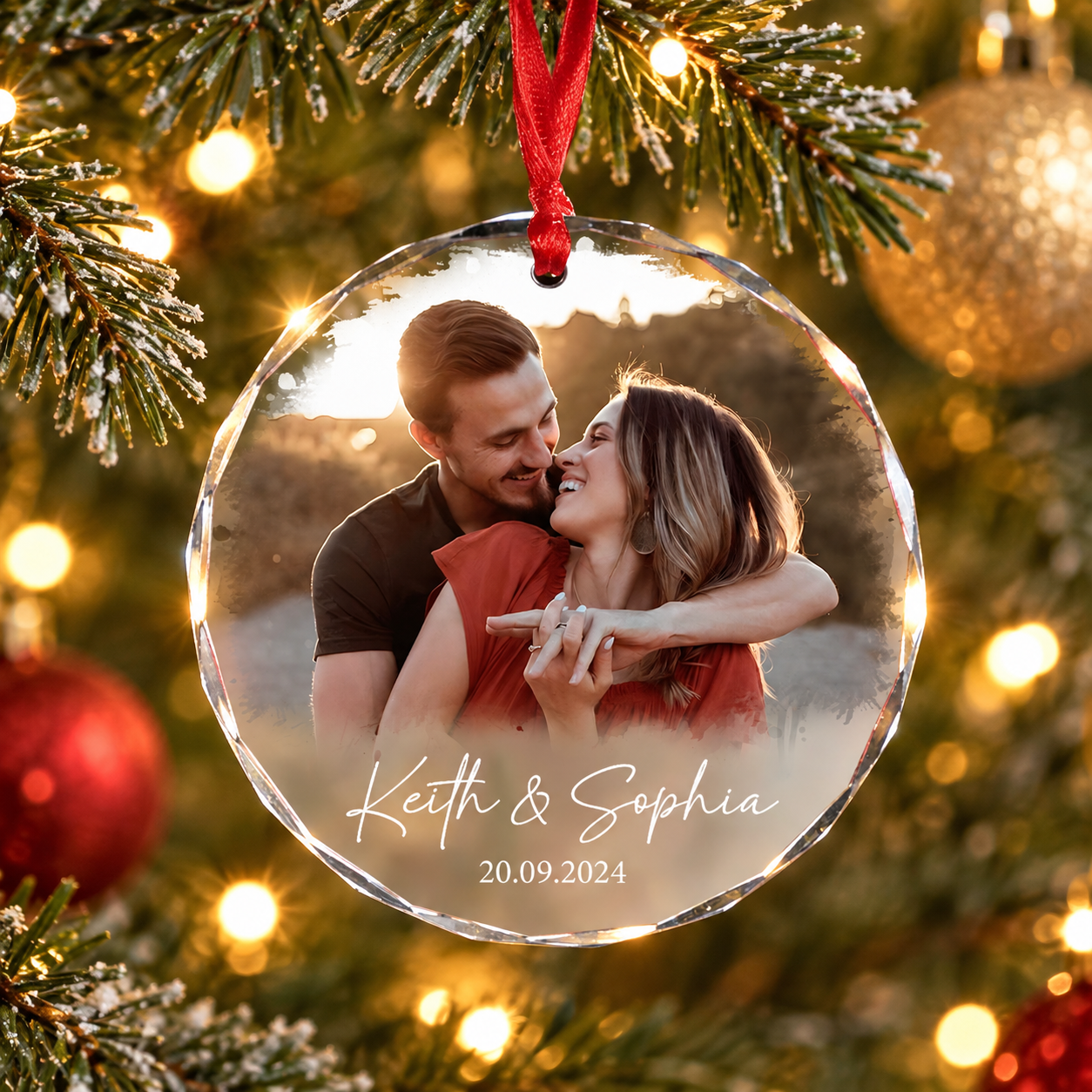 Personalized crystal glass couple photo ornament with names Keith and Sophia on a Christmas tree