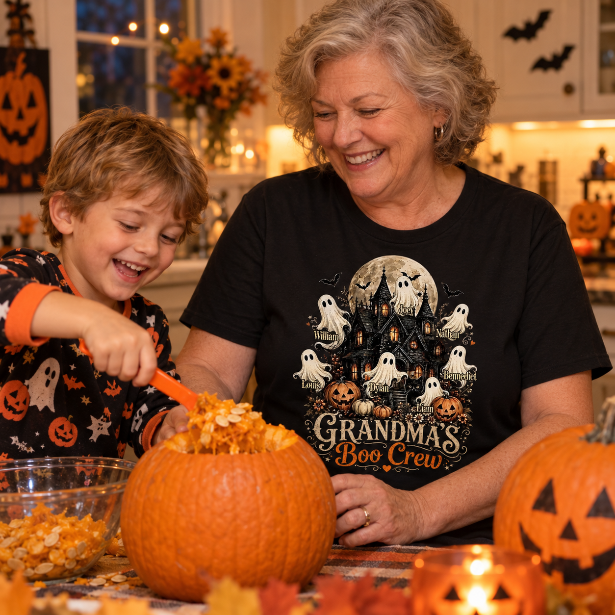 Grandma carving a pumpkin with her grandson in a personalized Boo Crew Halloween shirt