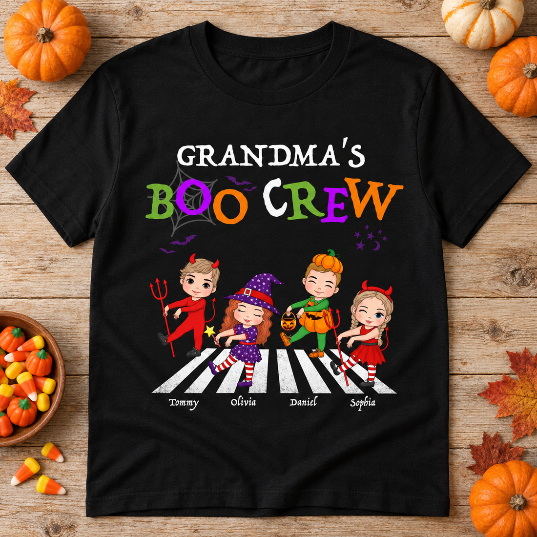 Black Grandma's Boo Crew personalized Halloween t-shirt flat lay with pumpkins and candy