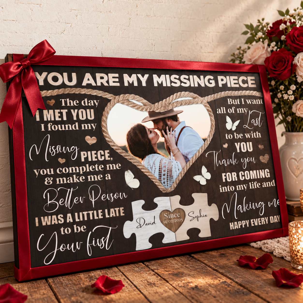 Personalized couple poster wrapped as an anniversary gift with ribbon beside red roses