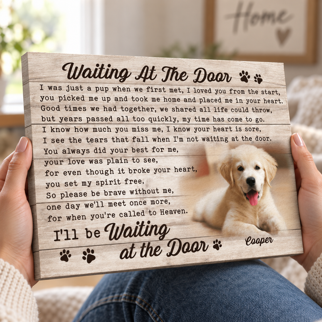 Hands gently holding a personalized pet memorial canvas, close-up of the canvas edge