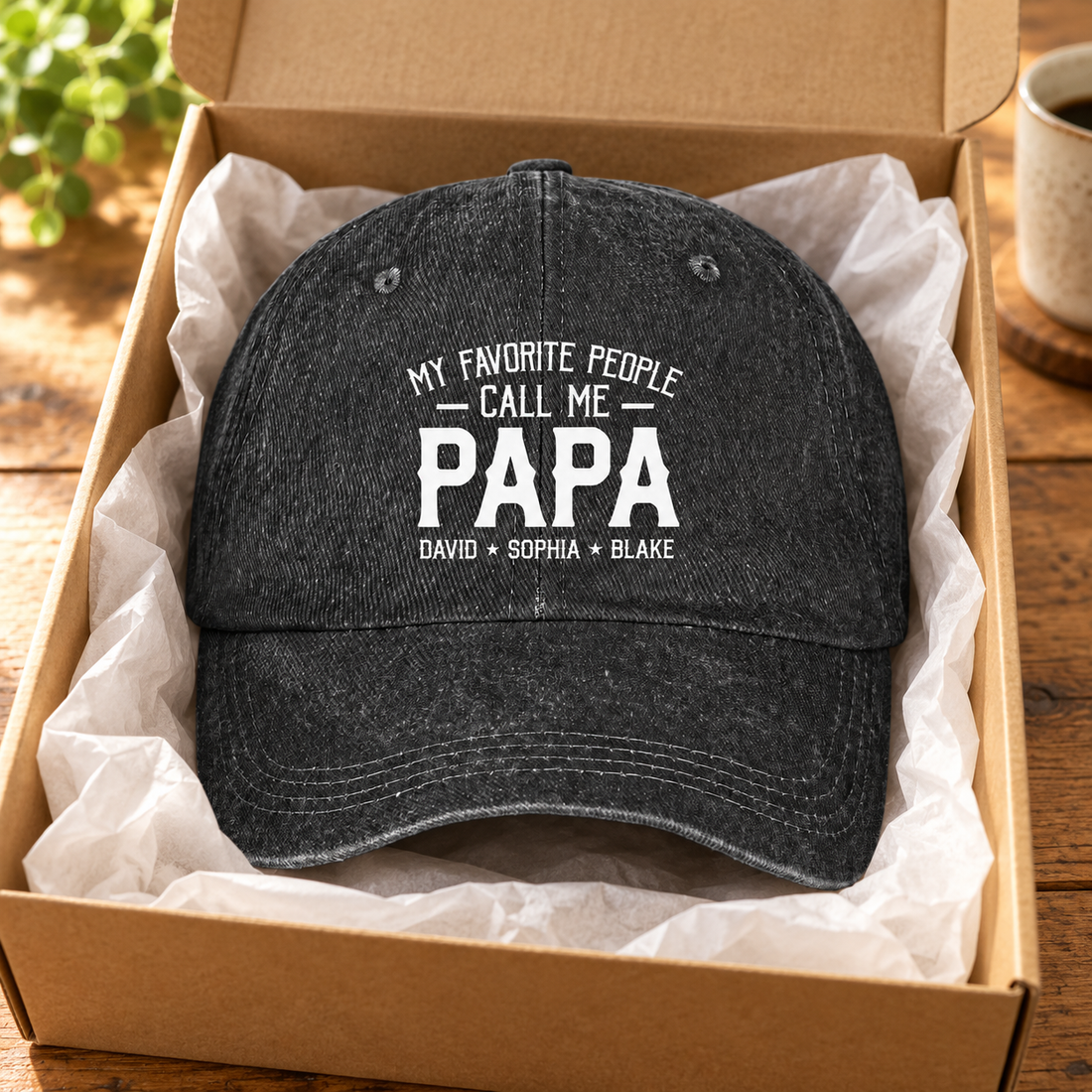 Personalized Papa washed denim cap with grandkids names in a kraft gift box with tissue paper