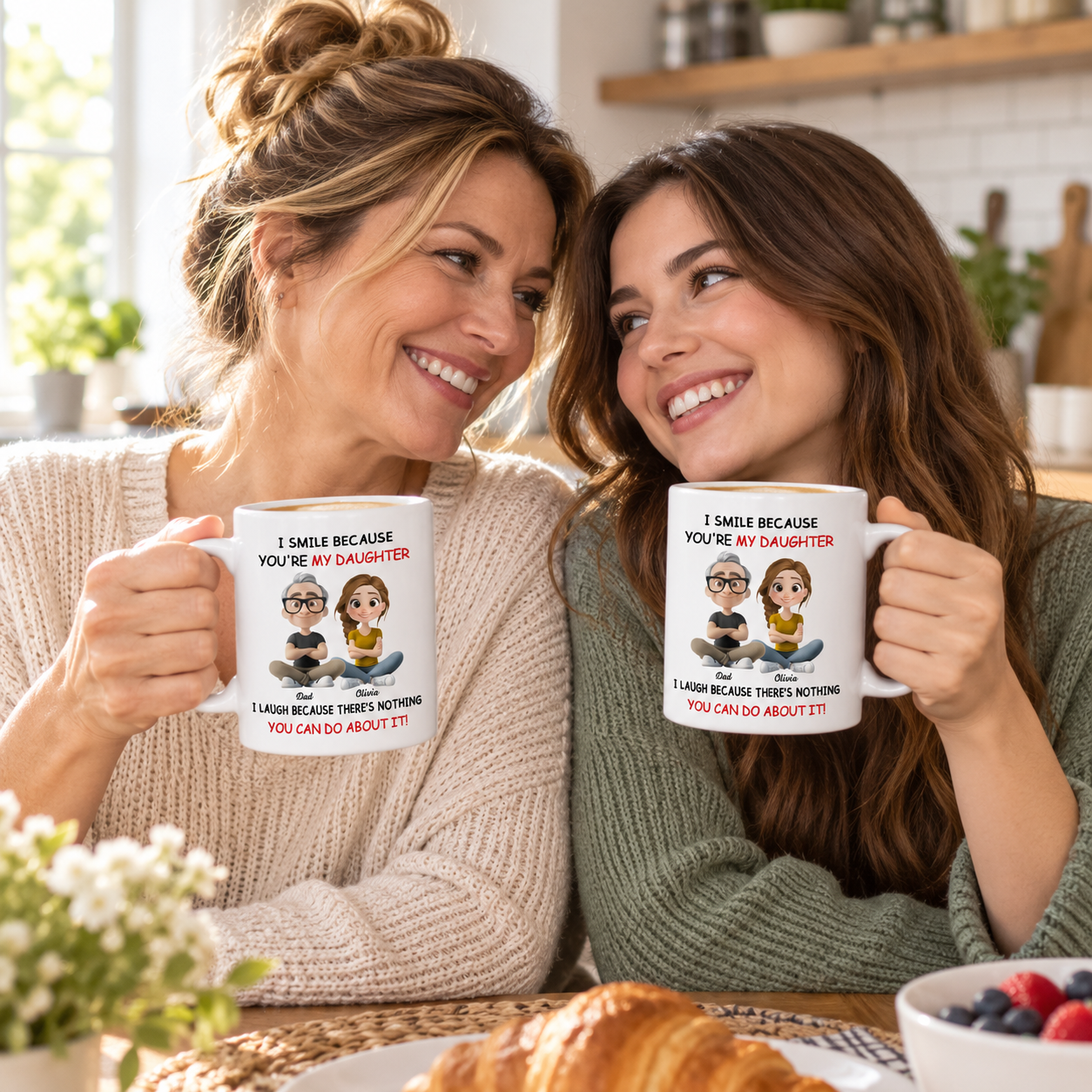 Mother and adult daughter drinking coffee from a personalized I Smile Because You're My Daughter mug