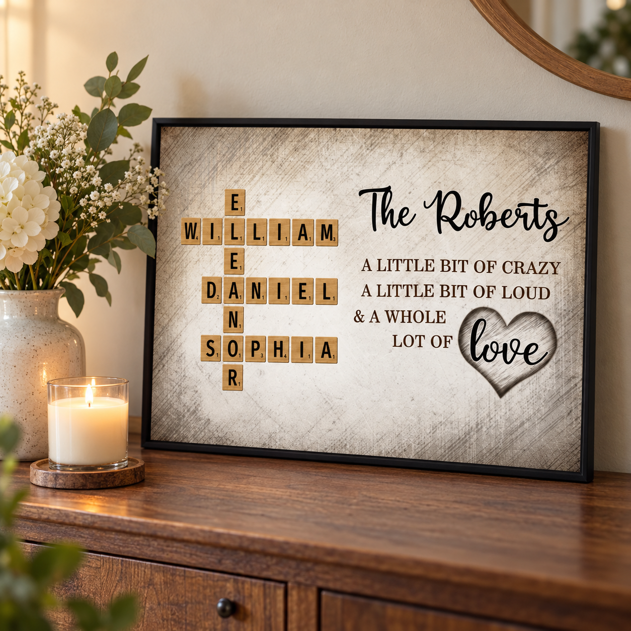 Custom crossword family names poster on a sideboard beside flowers and a candle