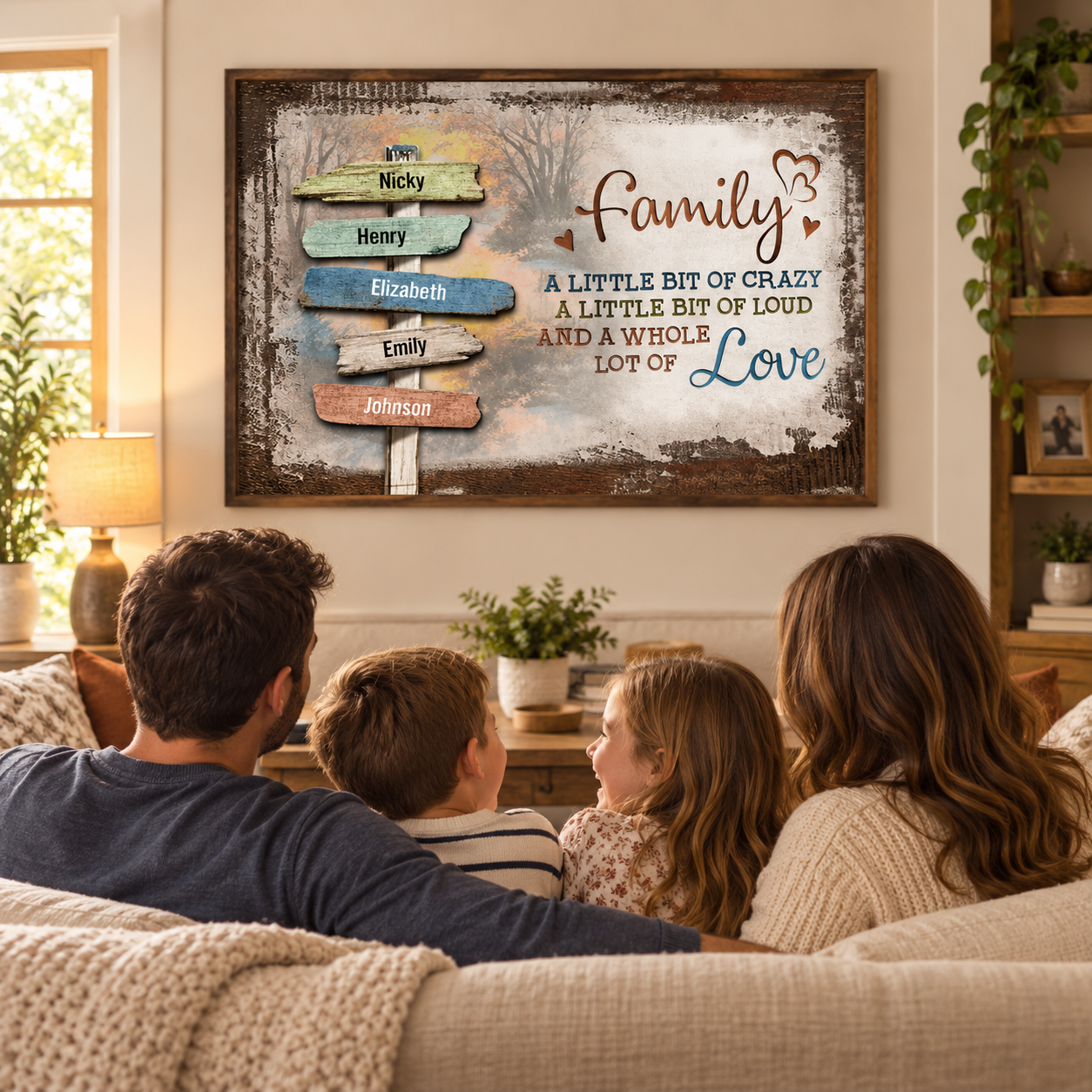 Custom Family name sign poster in a thin frame above a living room sofa with a family of four