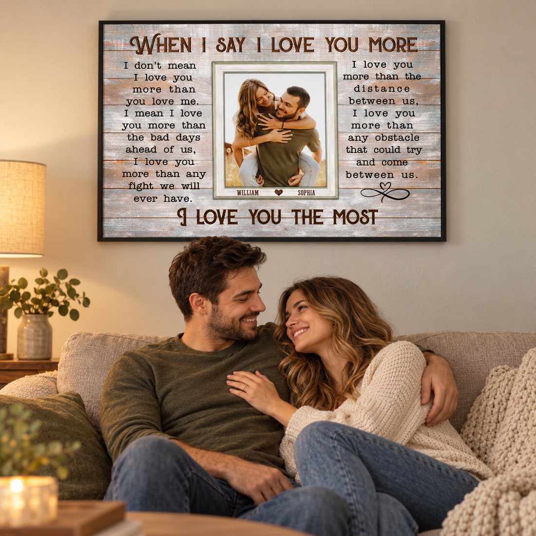Custom When I Say I Love You More couple photo poster above a sofa with a smiling couple
