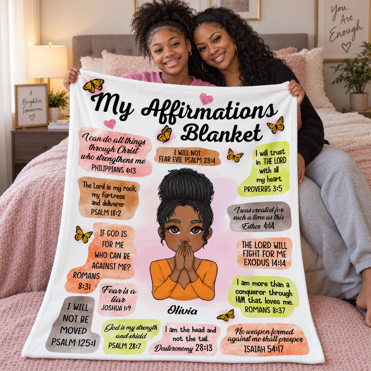 Mother and daughter holding a personalized My Affirmations blanket gift on a bed