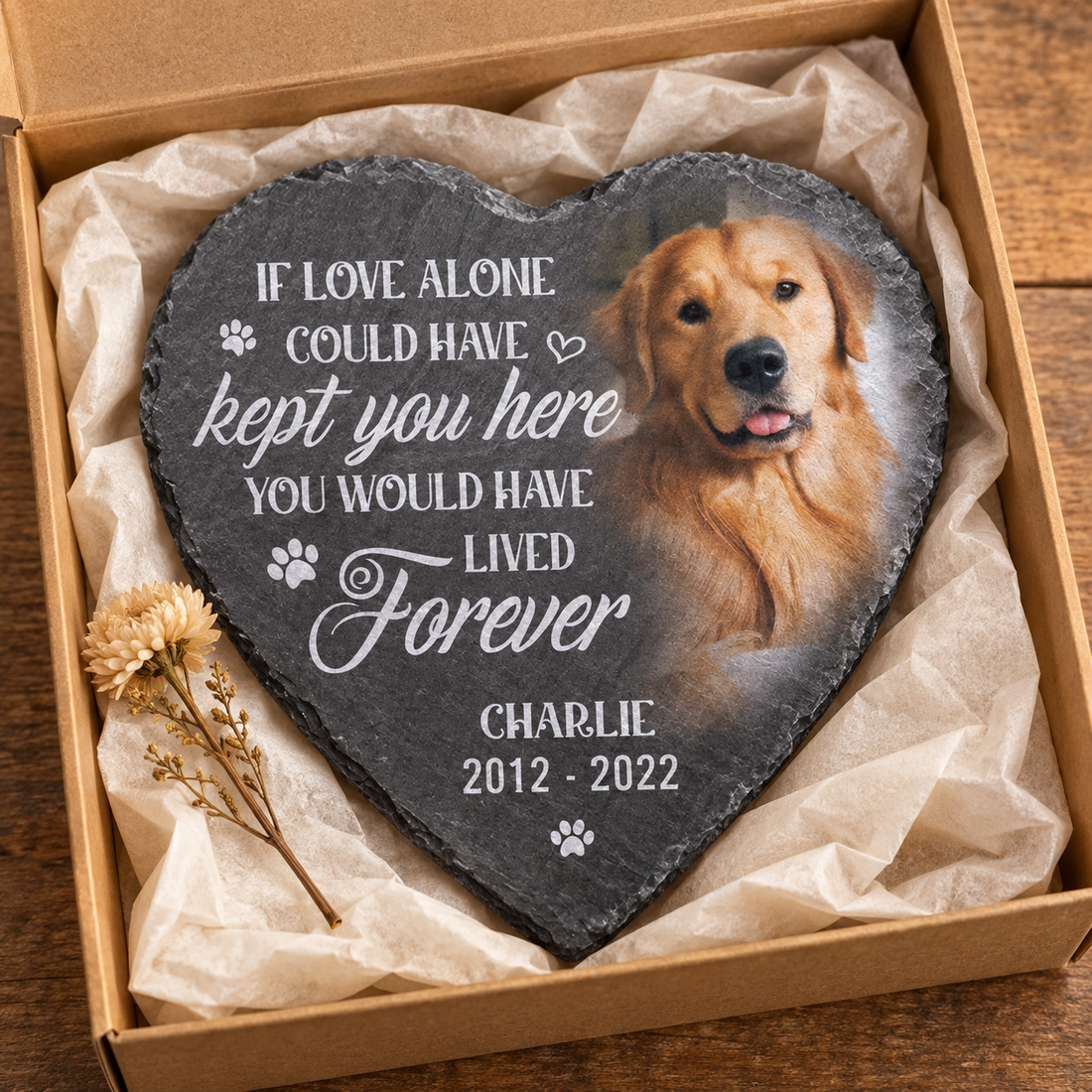 Personalized pet memorial heart stone with dog photo in a kraft gift box with tissue and a dried flower