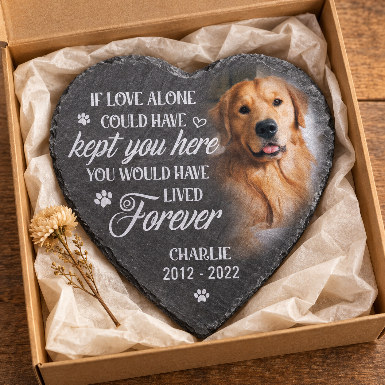 Personalized pet memorial heart stone with dog photo in a kraft gift box with tissue and a dried flower
