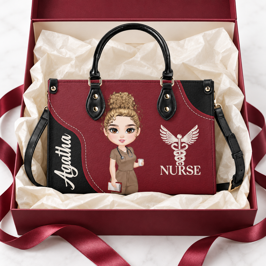 Custom burgundy leather nurse handbag with illustration in an open gift box with ribbon and tissue paper
