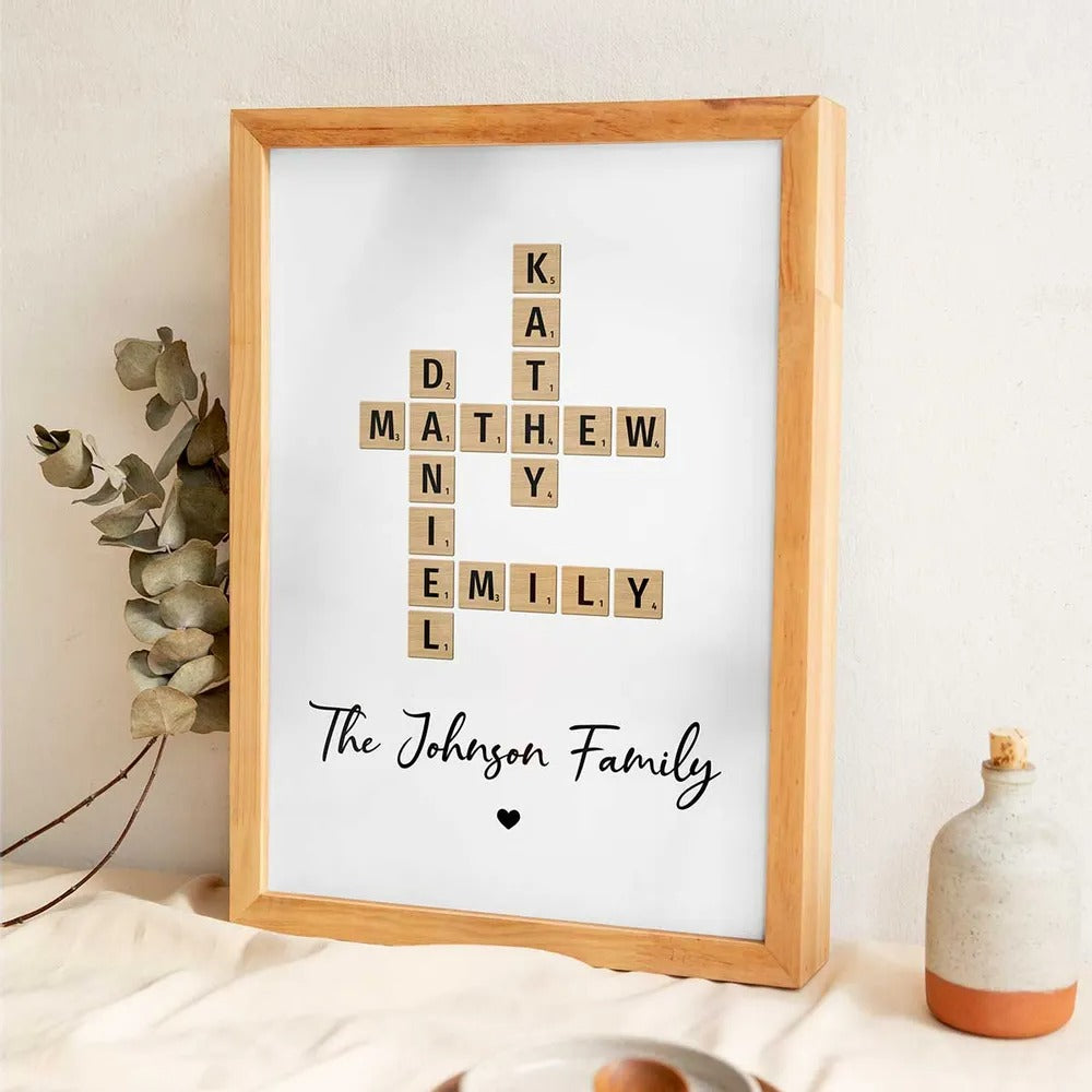 Personalized Family Crossword Art canvas print, a woman hanging the framed print on a wall