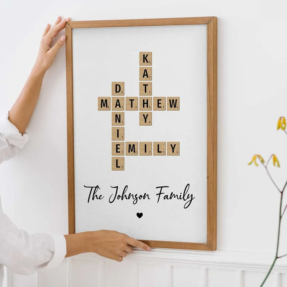 Personalized Family Crossword Art canvas print, leaning against a wall on a wooden floor