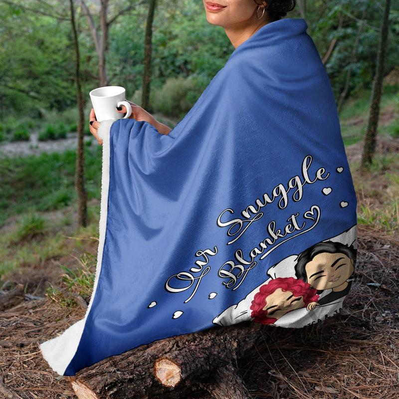 Personalized Couple Chibi Our Snuggle Blanket fleece blanket, spread across a bed