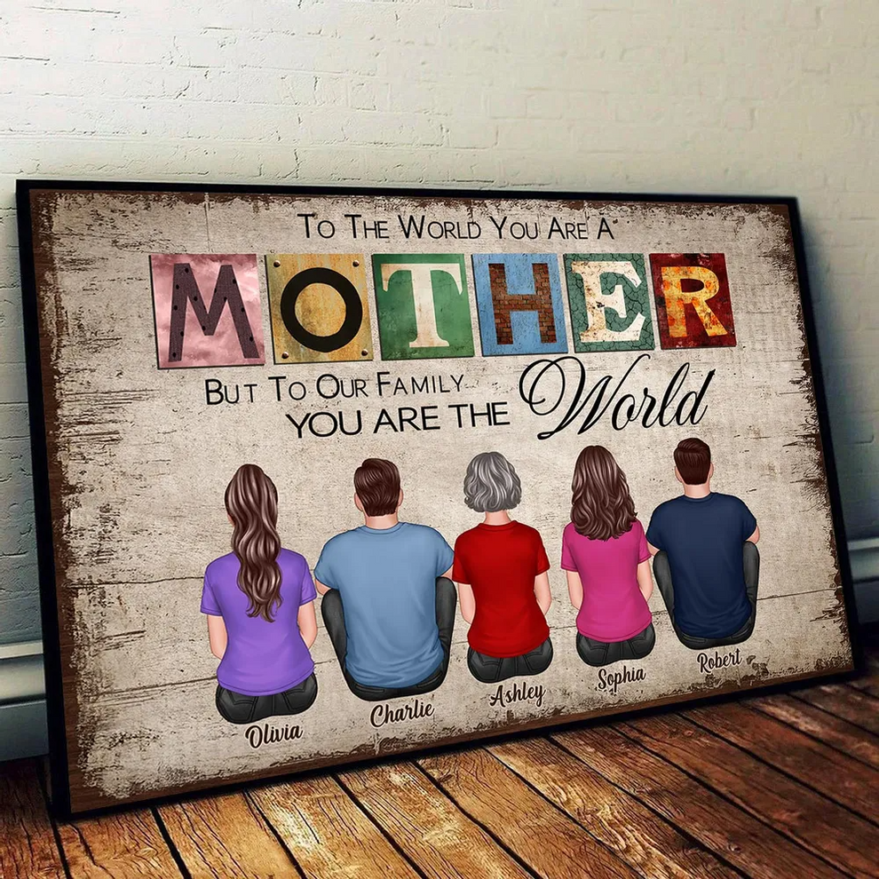 Personalized To The World You Are A Mother poster, leaning against a wall on a wooden floor