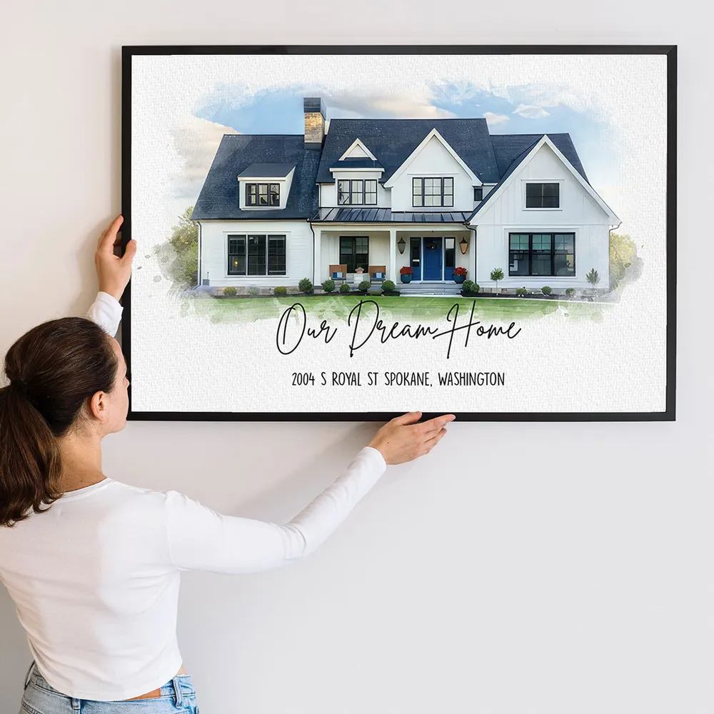 Personalized Custom Photo Watercolor House canvas print, a woman hanging the framed print on a wall