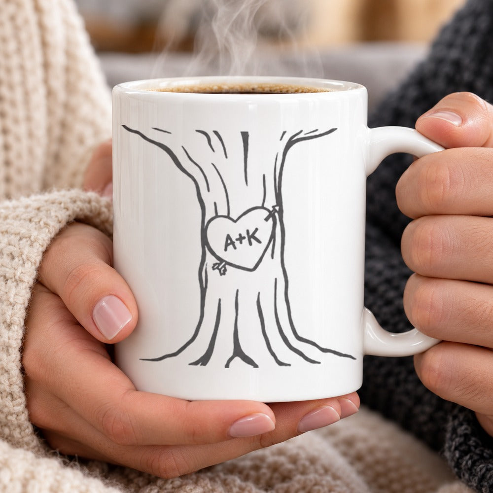Hands holding steaming custom heart tree couple ceramic mug