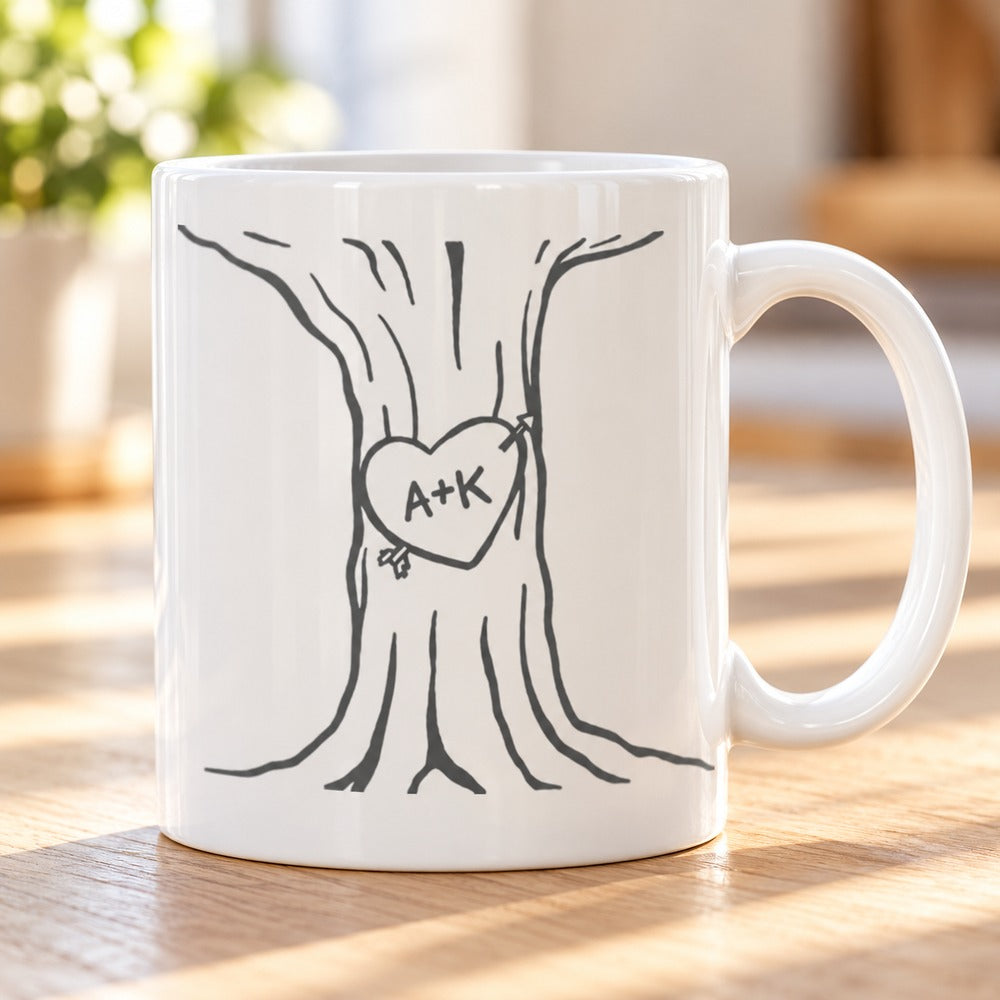 Close up detail of A+K heart tree print on white ceramic mug