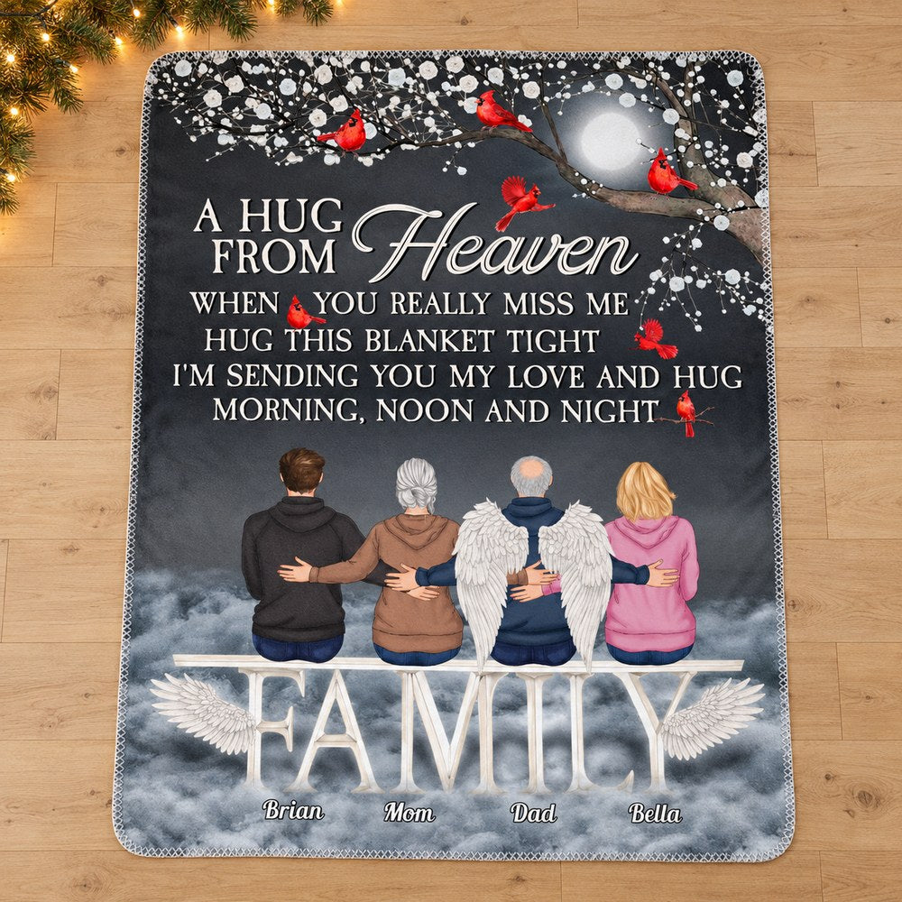 A Hug From Heaven personalized memorial blanket laid flat near Christmas garland