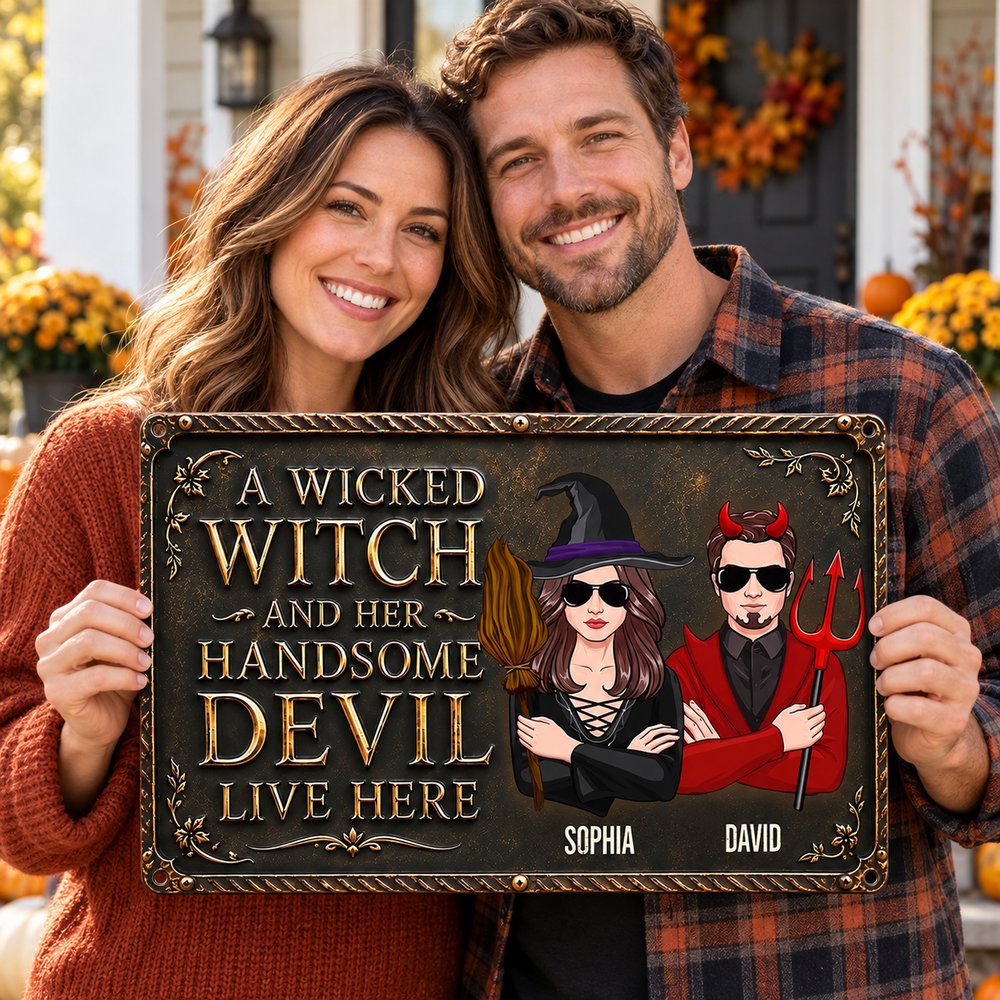 Husband and wife holding personalized Wicked Witch and Handsome Devil Halloween metal sign on porch
