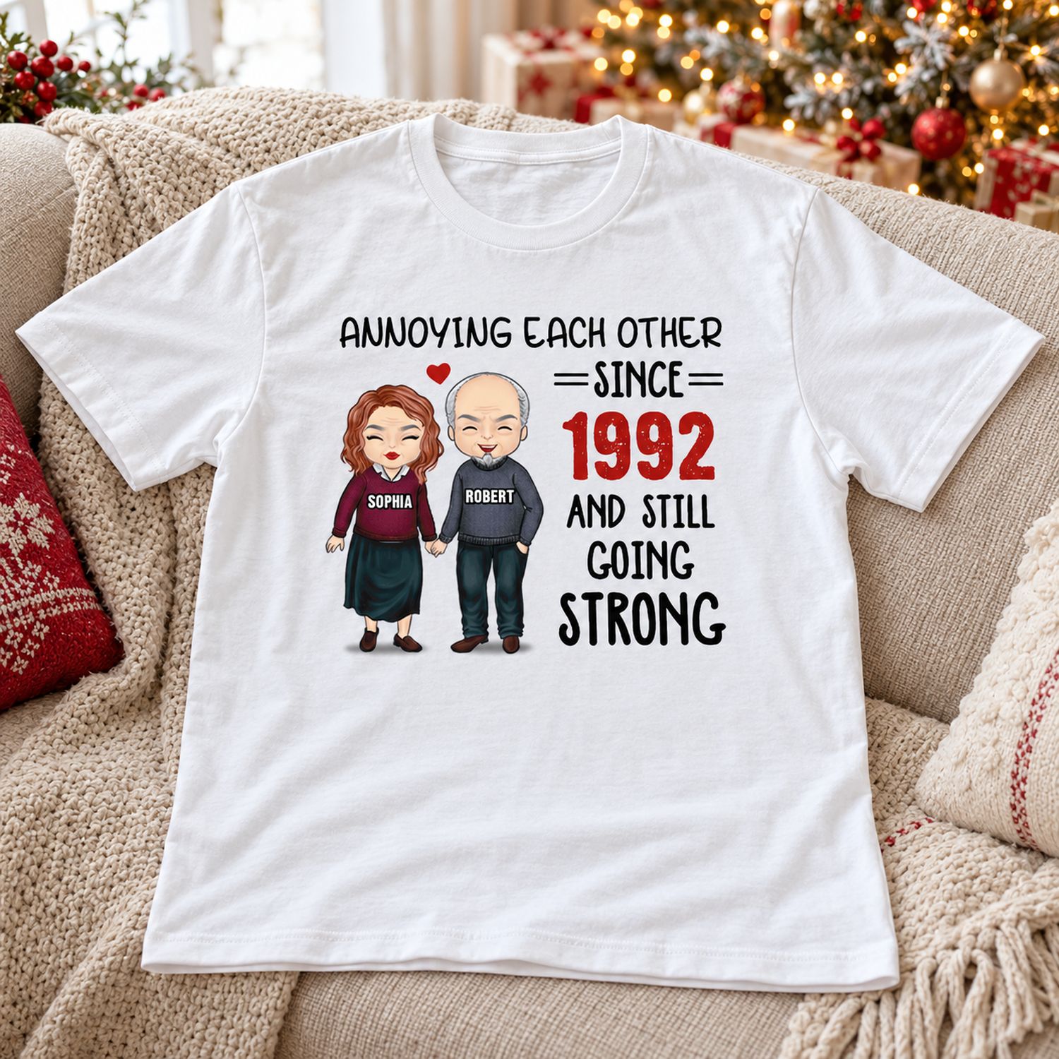Personalized Annoying Each Other couple t-shirt laid on sofa with holiday tree background