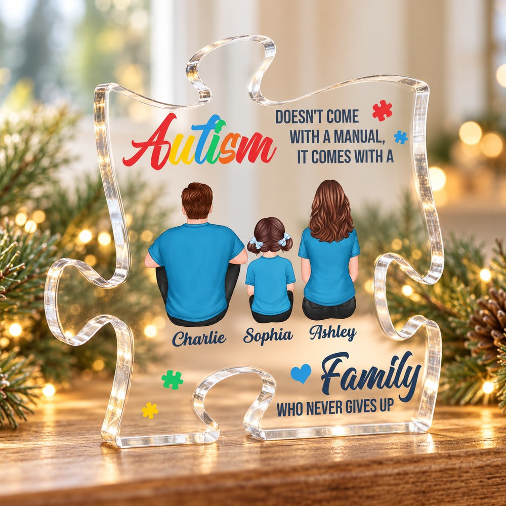 Autism family puzzle-shaped acrylic plaque standing on a holiday mantelpiece with pine greenery