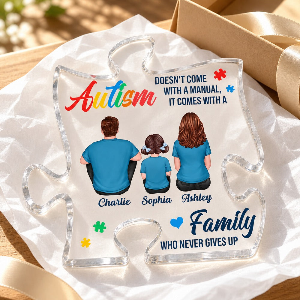Autism family personalized acrylic plaque next to a ribbon-tied gift box with tissue paper