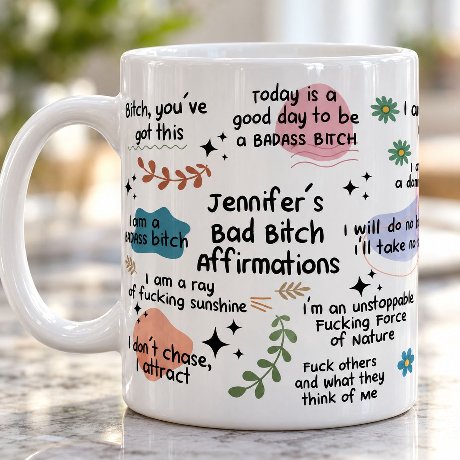 Close-up detail of glossy ceramic mug print showing Bad Bitch Affirmations text and pastel art