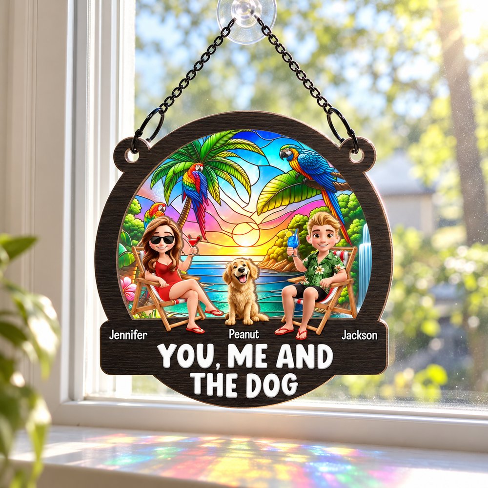 Personalized couple and dog beach suncatcher ornament hanging on a sunny living room window
