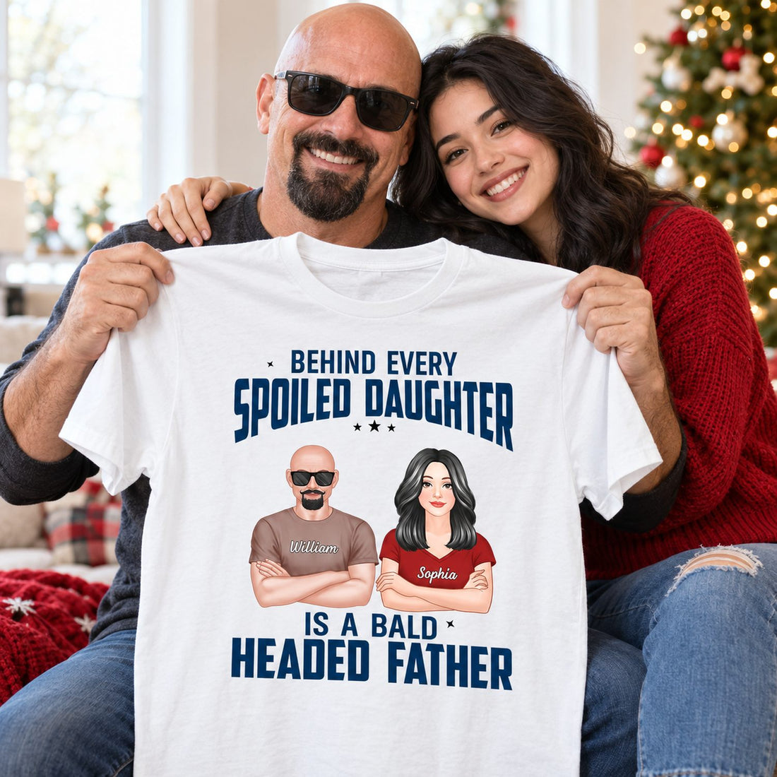 Daughter gifting custom Bald Headed Father t-shirt to her dad near a Christmas tree