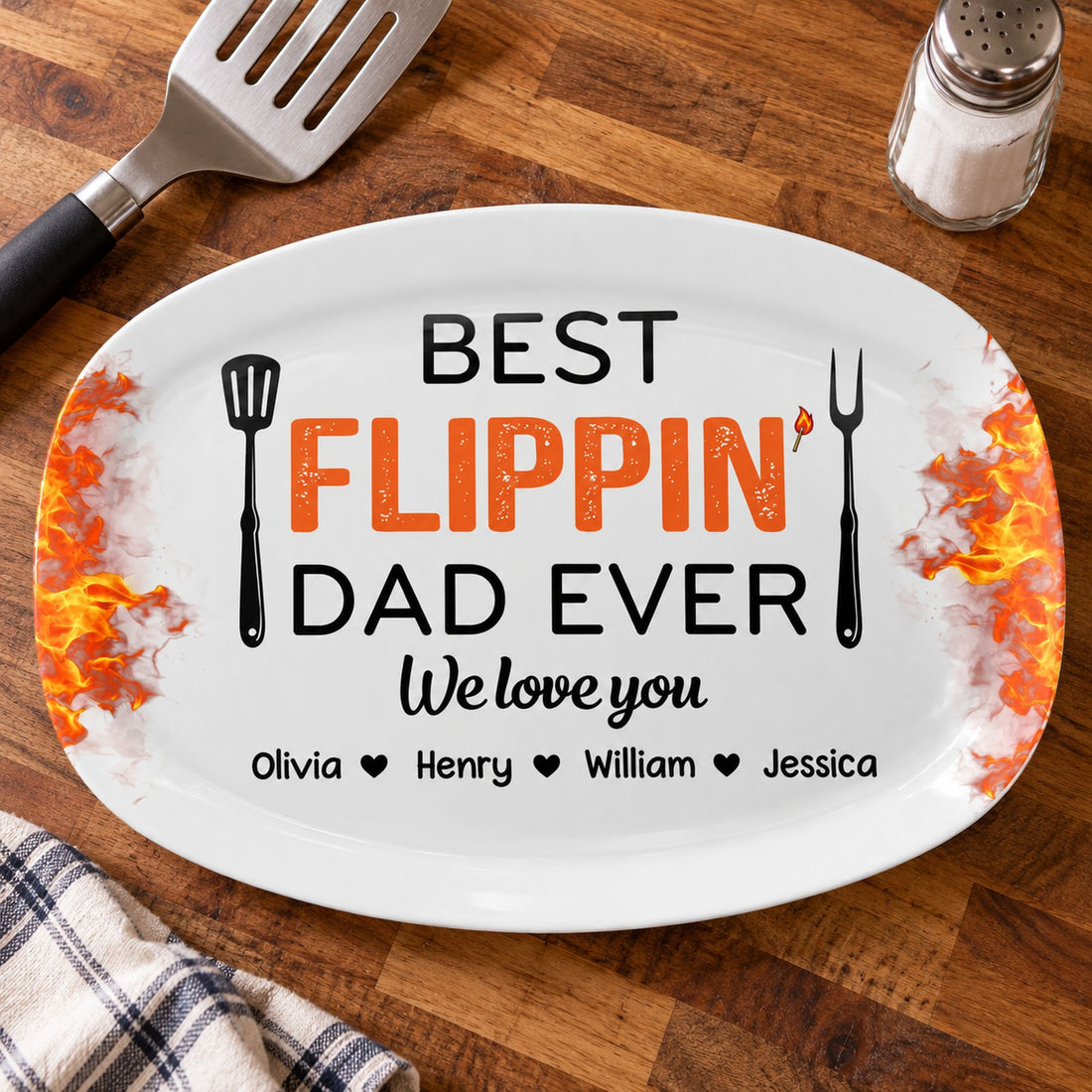 Size comparison of the Best Flippin Dad Ever platter next to a standard grilling spatula