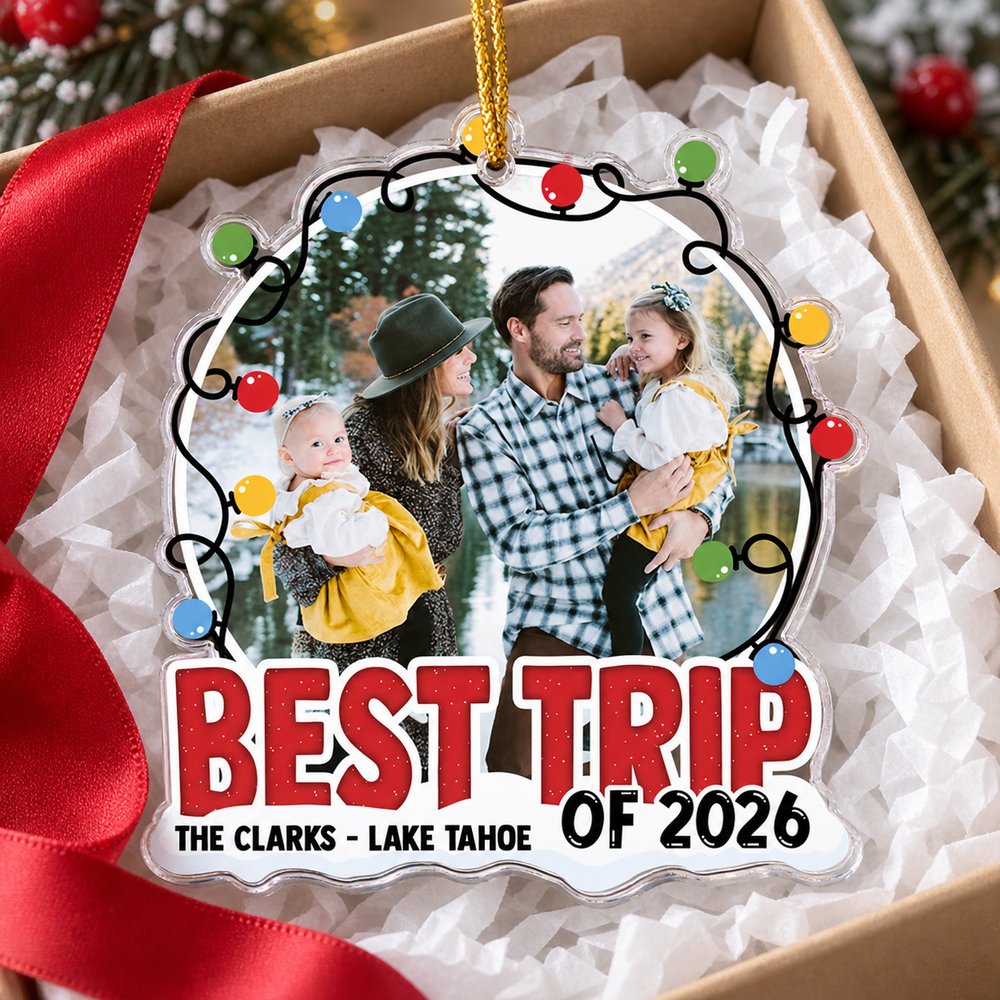 Best Trip Of 2026 personalized family ornament inside an open holiday gift box with red ribbon