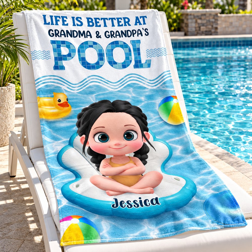 Personalized Grandma and Grandpa pool beach towel draped over a poolside lounge chair