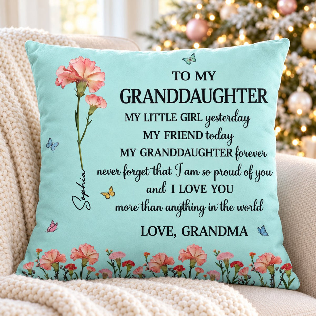 Personalized granddaughter birth flower pillow on armchair by Christmas tree