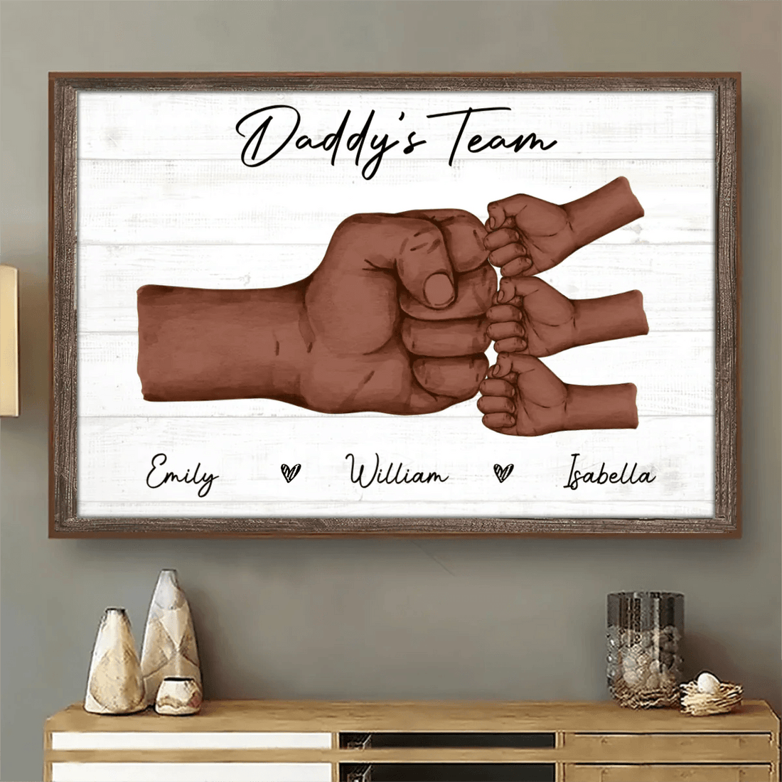 Personalized Fist Pump Black Daddy & Kids poster, a woman hanging the framed print on a wall