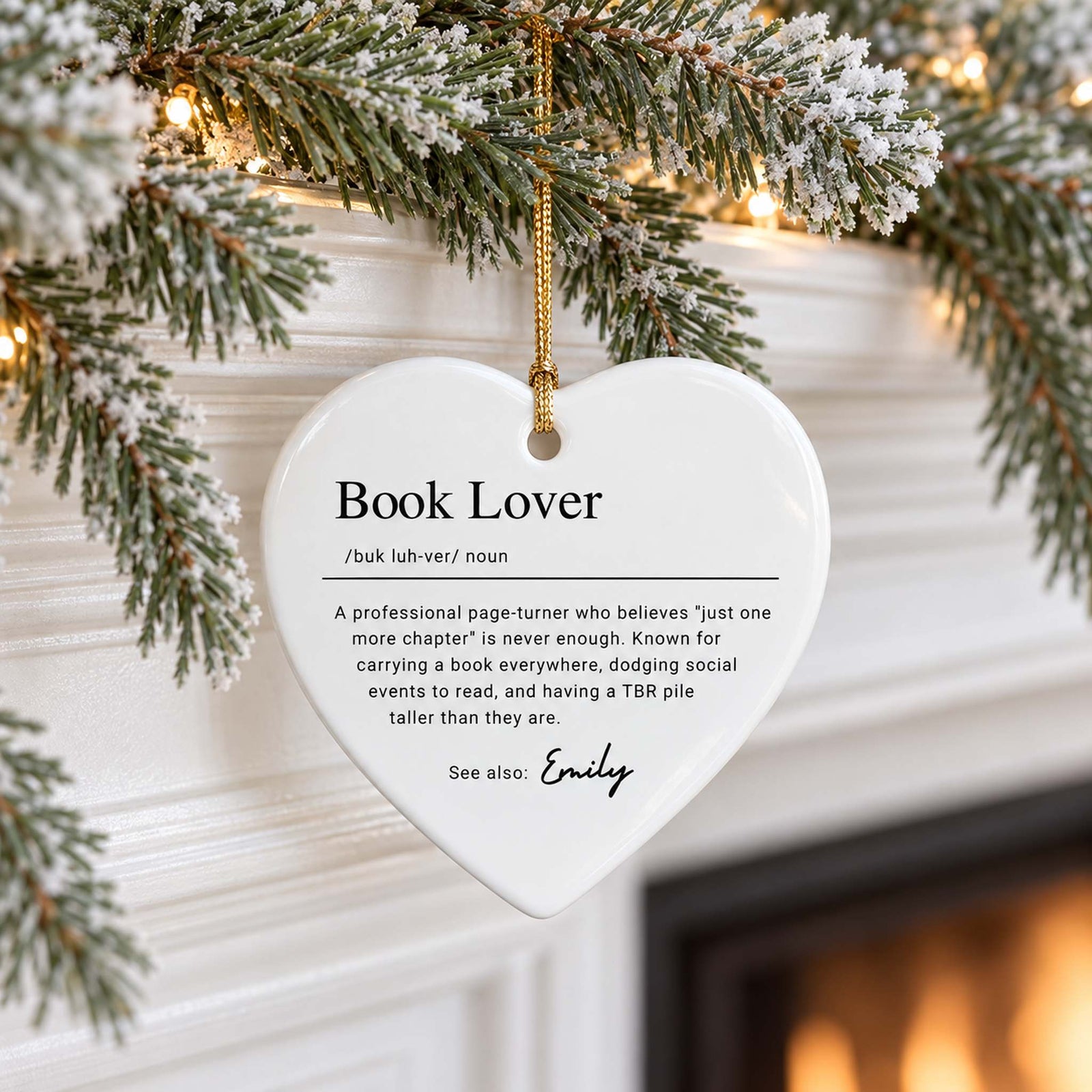 Heart-shaped Book Lover Definition ceramic ornament for Emily hanging on a holiday mantel garland