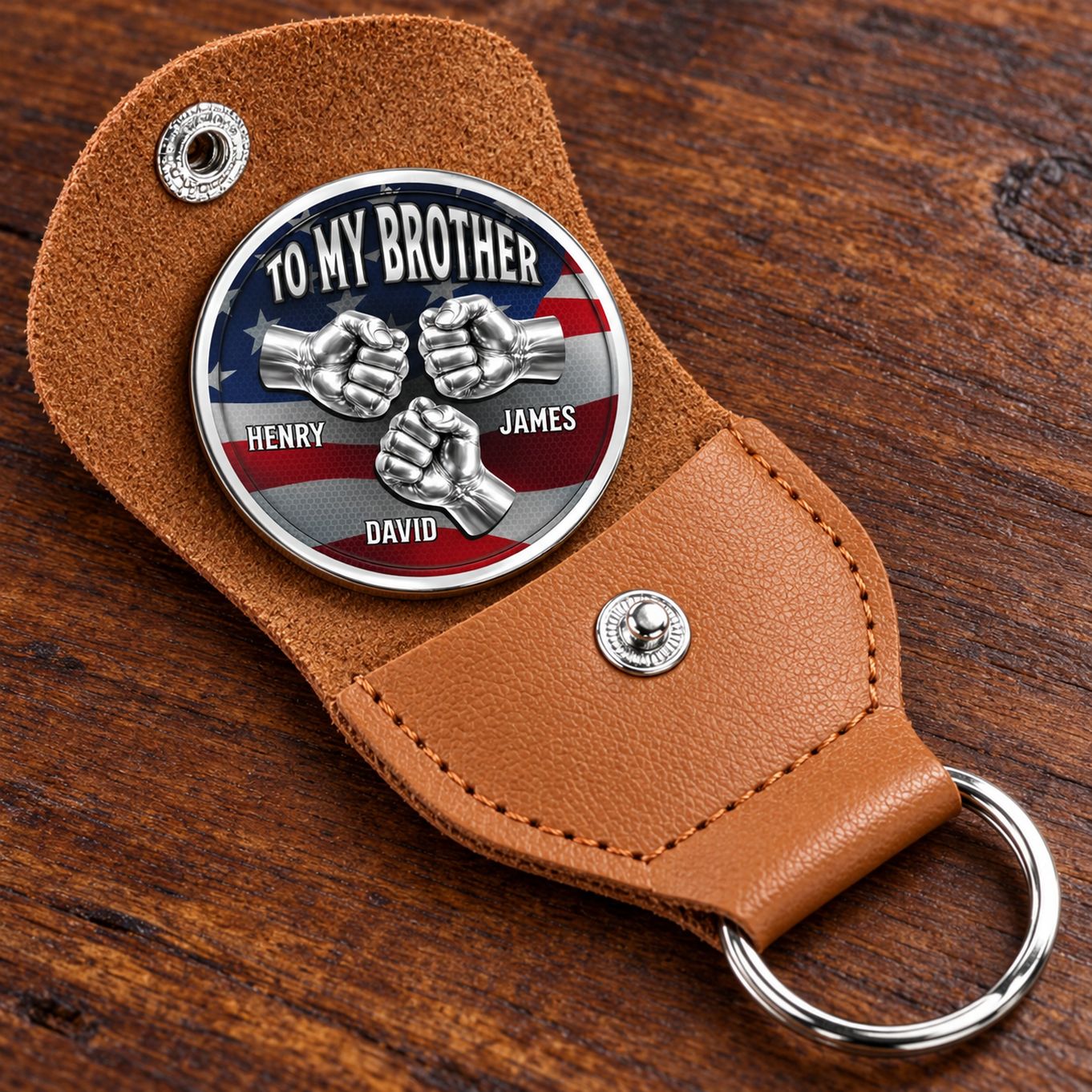 Close up detail of brother pocket hug stainless steel coin and stitched brown leather holder