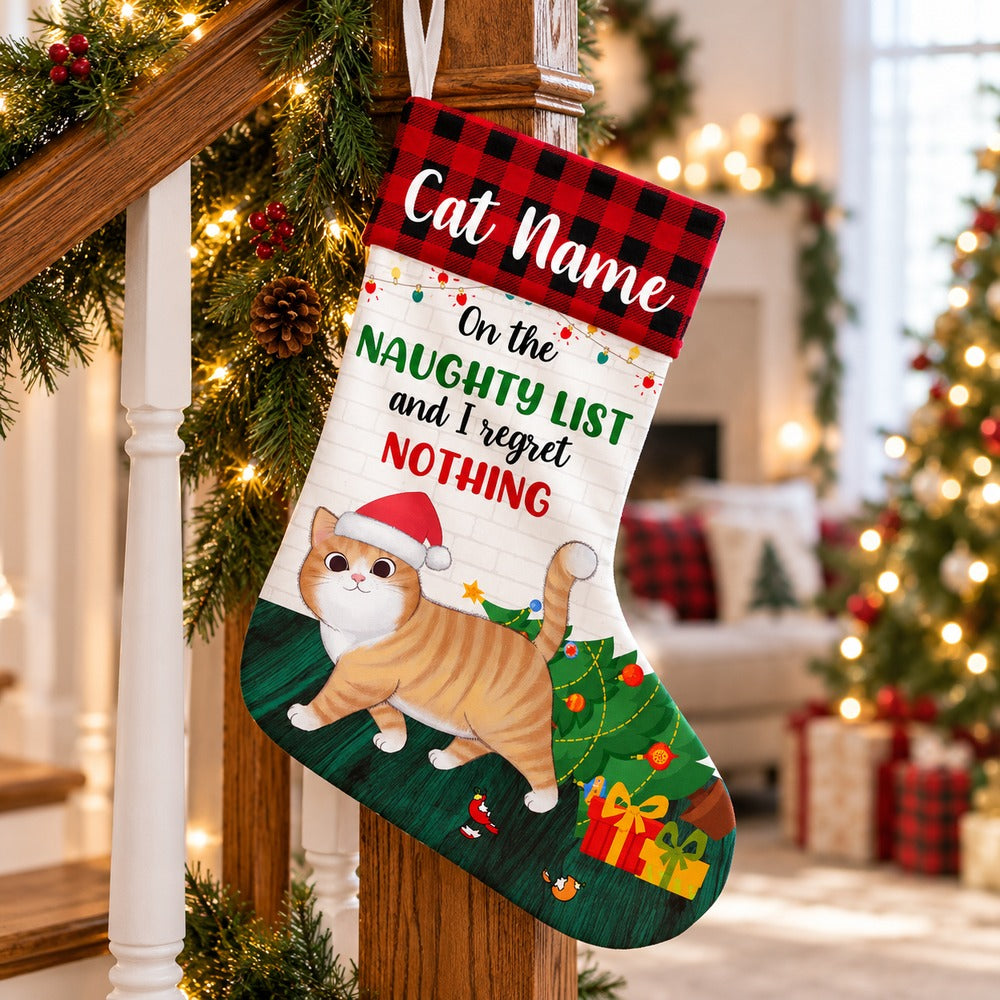 Personalized cat Christmas stocking with orange tabby design hanging on a festive staircase banister