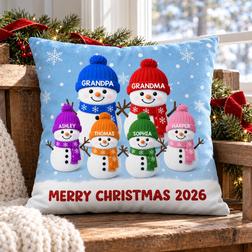 Personalized Grandma Grandpa snowman Christmas pillow on bench with pine garland