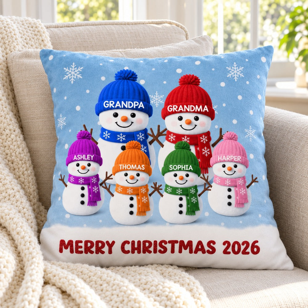 Custom snowman family Christmas pillow displayed on cozy armchair with knit throw