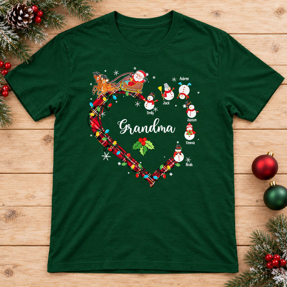 Personalized Grandma Christmas snowman t-shirt flat lay with festive pine garland