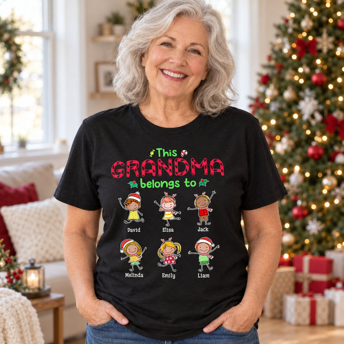 Grandma wearing personalized This Grandma Belongs To Christmas t-shirt in festive living room